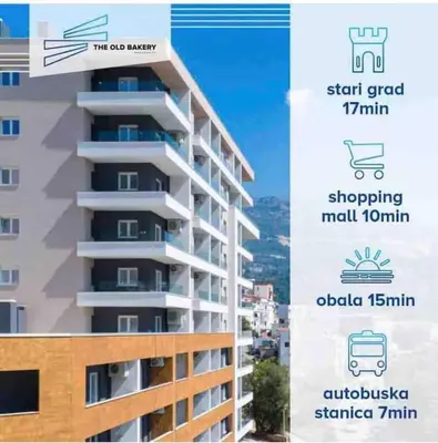 a rendering of a tall apartment building with a sign at E3 Apartment in Budva
