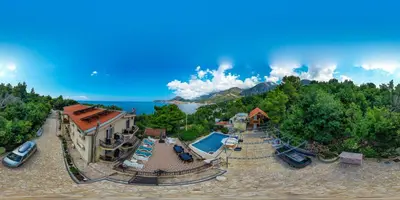 an aerial view of a resort with a swimming pool at VILA TARA in Sutomore