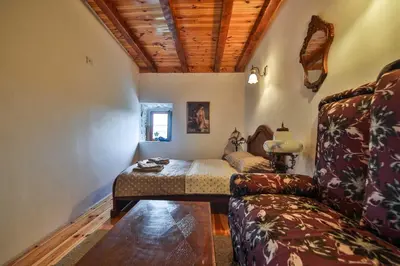 a living room with a couch and a table at Royal Villa Ana in Cetinje
