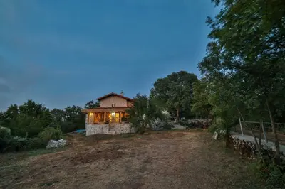 a house sitting on top of a field at Royal Villa Ana in Cetinje