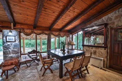 a dining room with a table and chairs at Royal Villa Ana in Cetinje