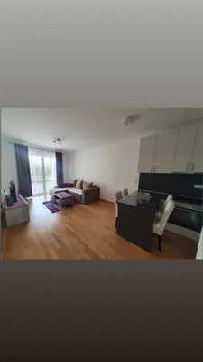 a living room with a couch and a table at Apartman Krstajić in Budva