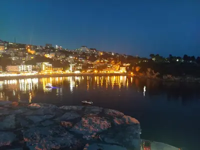 a view of a river at night with a city at DUBRAVA 115 in Dobra Voda