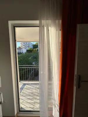 a sliding glass door with a view of a balcony at Apartment 2 in Bar, Susanj