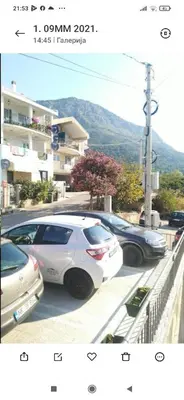 two photographs of cars parked in a parking lot at Apartment 2 in Bar, Susanj