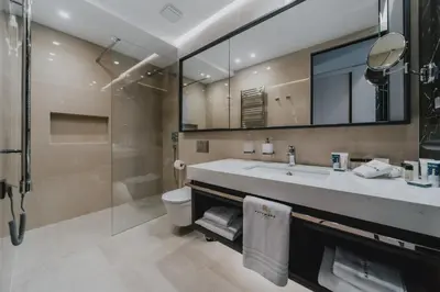 a bathroom with a sink and a toilet and a shower at Katamare Hotel in Budva