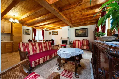 a living room with a couch and a table at Villa Helena in Kotor
