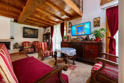 a living room with a couch and a tv at Villa Helena in Kotor