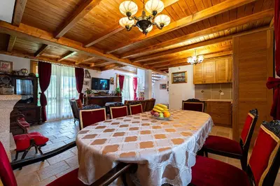 a dining room with a table with fruit on it at Villa Helena in Kotor
