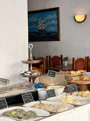a buffet with many different types of food on a table at Donna in Ulcinj