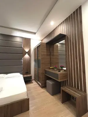 a bedroom with a bed and a desk at Donna in Ulcinj