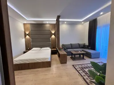 a bedroom with a bed and a couch at Donna in Ulcinj