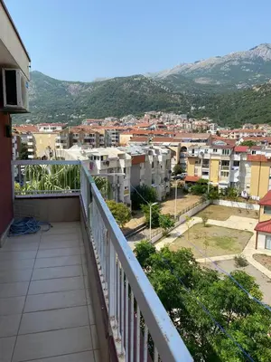 a balcony with a view of a city at Stan Budva Apartman in Budva
