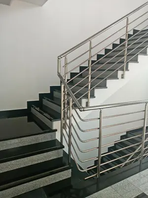 a set of stairs with metal railings at Apartment MERCURY in Budva
