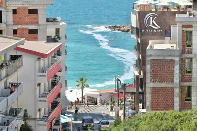 a view of the ocean from a street in front of buildings at 1bd Sea View Apts Veliki Pjesak 