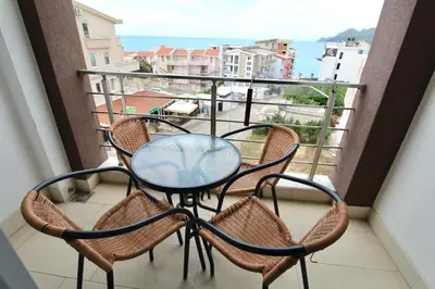a table and chairs on a balcony with a view at 1bd Sea View Apts Veliki Pjesak 