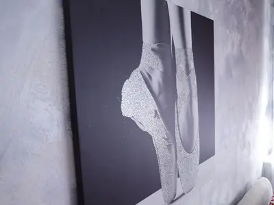 a picture of a knife hanging on a wall at Apartment Mona in Podgorica