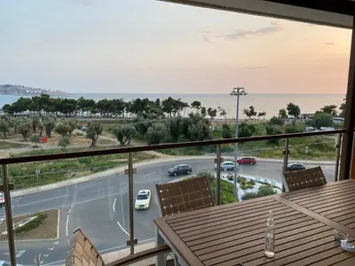 a balcony with a view of a road and the ocean at Bitcoin and Ethereum Deluxe Apartments in Bar
