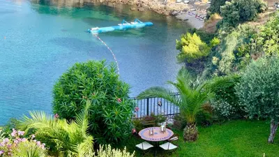 a barge in the water with a boat in it at Le petit bonheur in Ulcinj