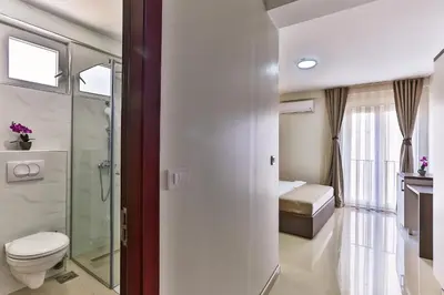 a bathroom with a toilet and a shower at Atlantic sobe in Dobra Voda
