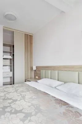 a bedroom with a large white bed with a large bedspread at Top-hill stunning view 2 bdr apt with swimming pool in Komoševina