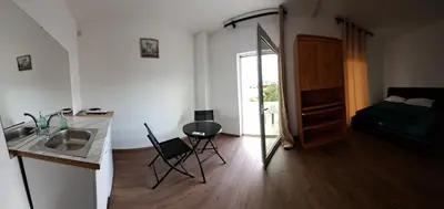 a bathroom with a sink and a mirror in a room at Vila Arb in Ulcinj