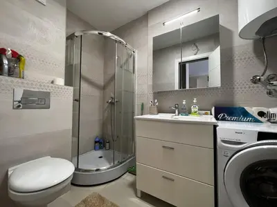 a bathroom with a shower and a toilet and a sink at Budva Centar in Budva