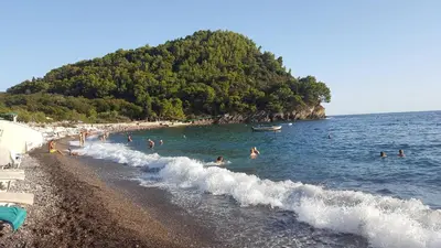a group of people in the water at a beach at Villa Blanca in Petrovac na Moru