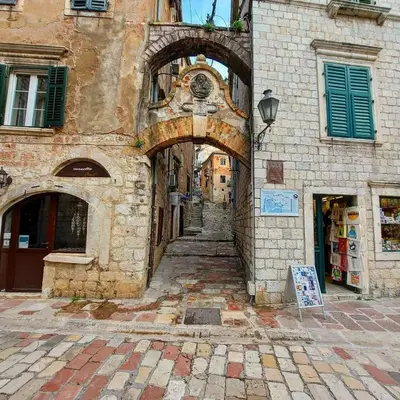an alley in an old building with an archway at OLD TOWN 303 in Kotor