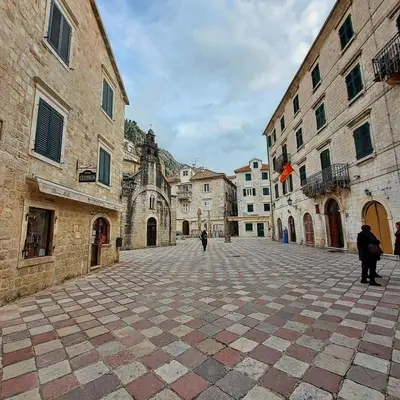 a cobblestone street in an old town with buildings at OLD TOWN 303 in Kotor
