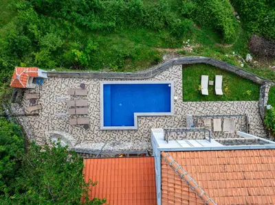 an aerial view of a house with a swimming pool at Villa Tranquila in Budva