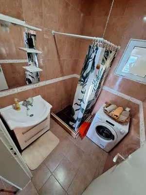 an overhead view of a bathroom with a shower and a sink at Sunset in Ulcinj