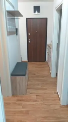 a hallway with a wooden floor and a door at Jovan Vukovic in Kotor
