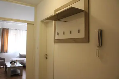 a room with a door with a picture on the wall at Jovan Vukovic in Kotor