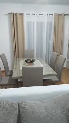 a dining room with a table and chairs at Jovan Vukovic in Kotor