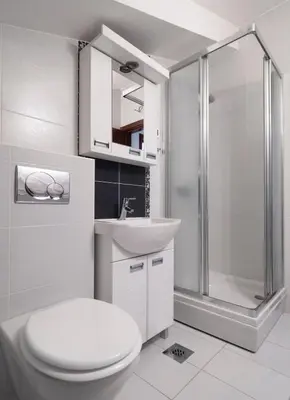 a bathroom with a toilet and a shower and a sink at Skyline Penthouse Budva in Budva