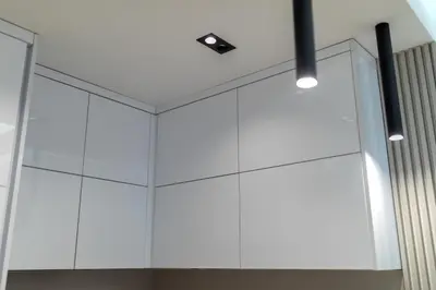a room with white cabinets and lights on the ceiling at Bar Exclusiv Soho city Residence in Bar