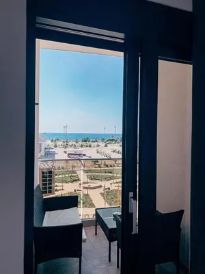 a room with a view of an airport from a window at Bar Exclusiv Soho city Residence in Bar