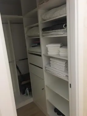 a closet with white towels and towels at Bar Exclusiv Soho city Residence in Bar