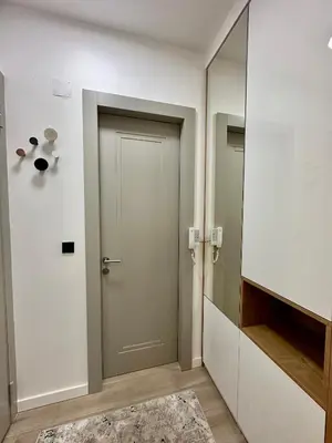 a hallway with a door and a mirror at Casa Al Mare Residence Apartment Lena in Budva