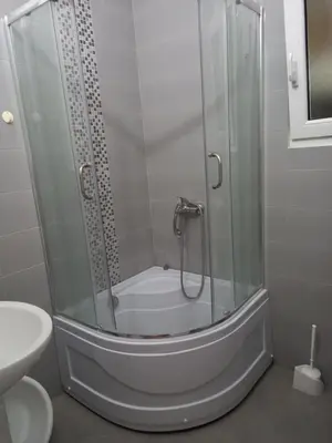 a shower with a glass enclosure in a bathroom at MD Apartmani Canj in Čanj