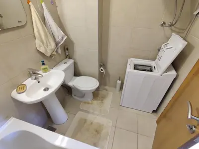 a bathroom with a white toilet and a sink at Good morning Petrovac in Petrovac na Moru