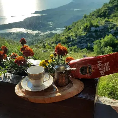 a tray with a cup and a coffee mug on a table at Livari Rooms Exclusive Chalet in Bar