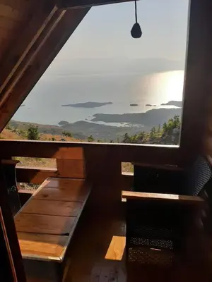 a window in a room with a view of the ocean at Livari Rooms Exclusive Chalet in Bar