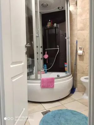 a bathroom with a shower with a tub and a toilet at Apartment Anika in Becici