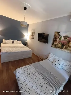 a bedroom with a bed and a tv in it at Apartment Anika in Becici