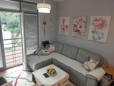 a living room with a couch and a table at Apartment Anika in Becici