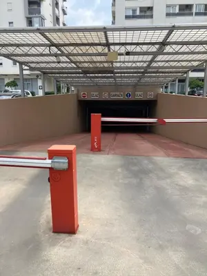 a red bench sitting in front of a building at Apartment Alex in Bar