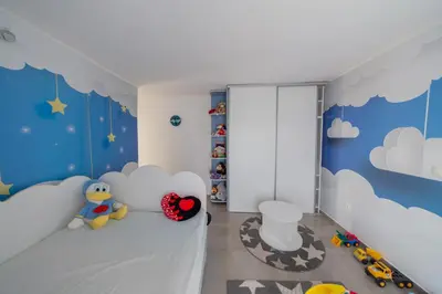 a childs bedroom with clouds and toys at Villa Hacienda in Budva