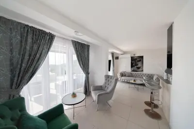 a living room with a couch and a table at Villa Hacienda in Budva